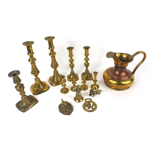 107 - Assorted brassware including four pairs of candlesticks, jug, horse brasses etc