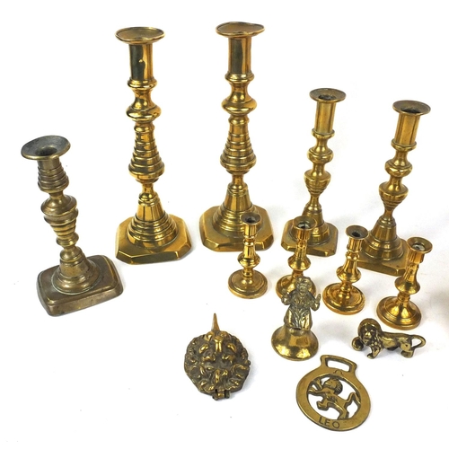 107 - Assorted brassware including four pairs of candlesticks, jug, horse brasses etc