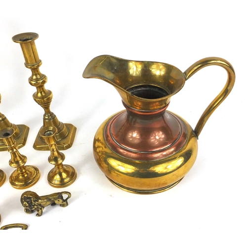 107 - Assorted brassware including four pairs of candlesticks, jug, horse brasses etc