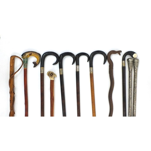 31 - Group of eleven walking sticks, some with horn handles and some with silver coloured metal mounts