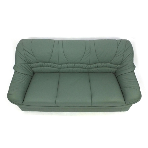 65 - Mint green leather three seater settee and two seater settee, the larger 180cm long