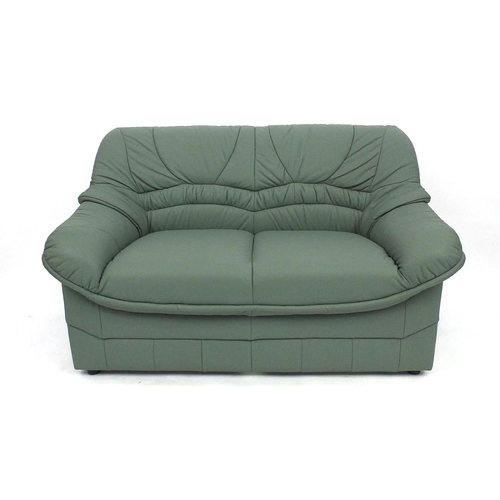 65 - Mint green leather three seater settee and two seater settee, the larger 180cm long