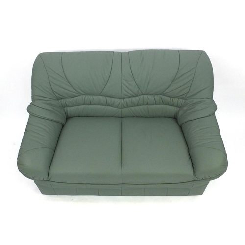 65 - Mint green leather three seater settee and two seater settee, the larger 180cm long