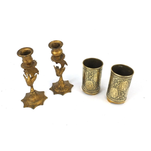 608 - Pair of Military trench art shell vases and a pair of gilt metal peacock candle sticks, the larger 1... 