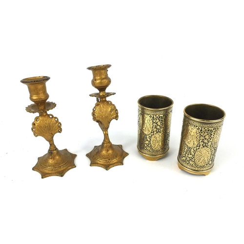 608 - Pair of Military trench art shell vases and a pair of gilt metal peacock candle sticks, the larger 1... 