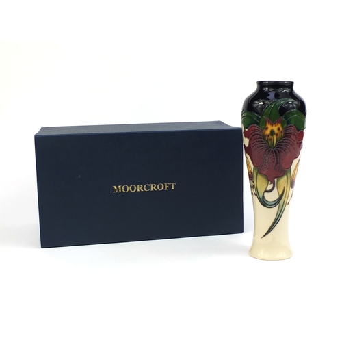2168 - Boxed Moorcroft pottery vase, hand painted and tube lined with stylised flowers, with original label... 
