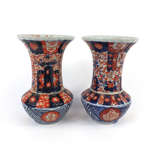 163 - Two Japanese Imari pattern vases, the larger 24cm high