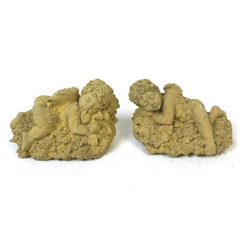 56 - Pair of garden stoneware cherubs, 32cm long