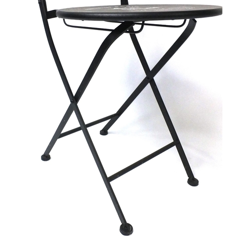 30 - Bistro De Paris metal table and two folding chairs, the table 75cm high x 61cm in diameter