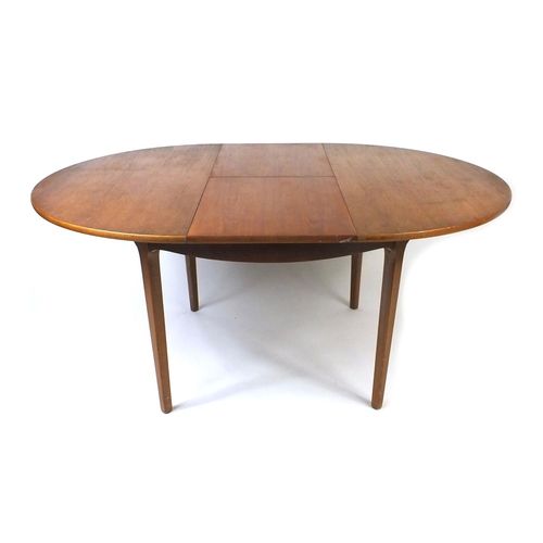 46 - Nathan teak extending dining table with a set of four Farstrup Danish chairs, the table 75cm high x ... 