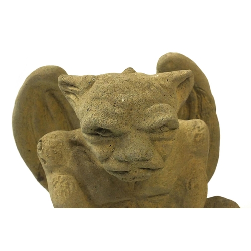 89 - Three garden stoneware winged goblin tea light holders, 24cm high