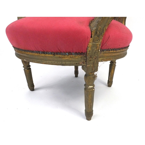 87 - French carved gilt wood elbow chair with salmon upholstery