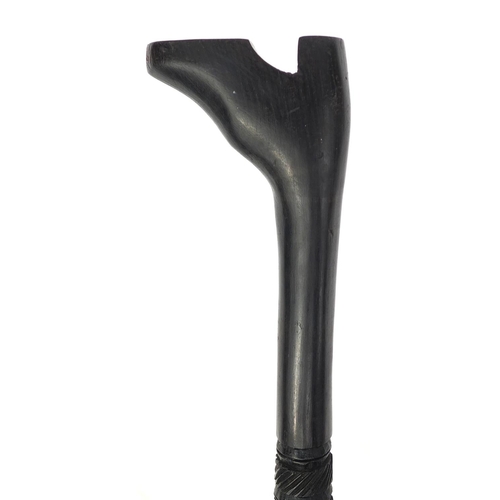 181 - Ebonised walking stick with carved handle in the form of a shoe, 87cm long