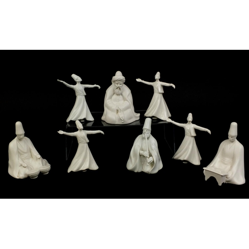 2094 - Group of Yildiz porcelain whirling Dervish figures, factory marks to the bases, the largest 13cm hig... 