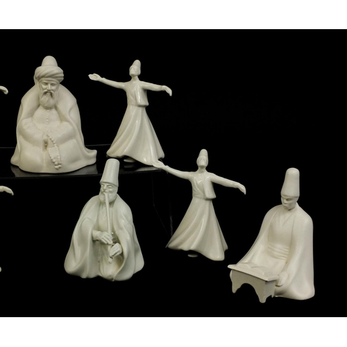 2094 - Group of Yildiz porcelain whirling Dervish figures, factory marks to the bases, the largest 13cm hig... 