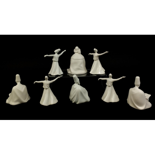 2094 - Group of Yildiz porcelain whirling Dervish figures, factory marks to the bases, the largest 13cm hig... 