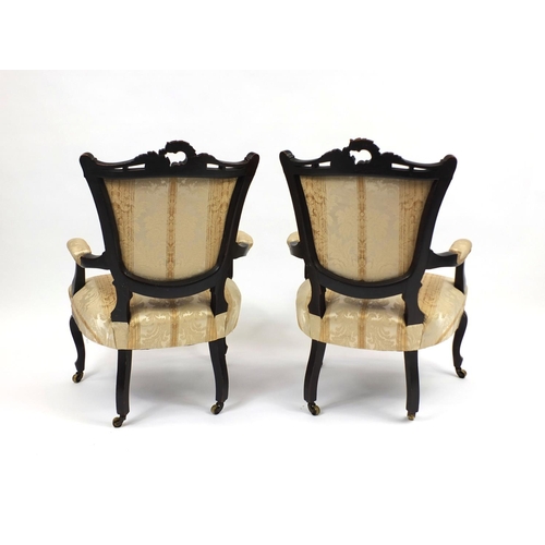 2004 - Pair of carved mahogany salon chairs with beige striped floral upholstery, each 91cm high