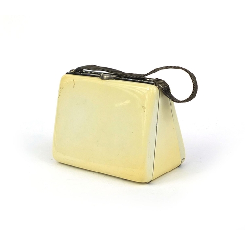 84 - Art Deco combination compact in the form of a handbag, 10cm wide