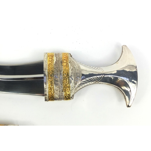 656 - Omani khanjar dagger with sheath, the handle and sheath with gold and silver coloured floral motifs,... 