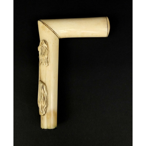 165 - Bone walking stick/crop handle carved with a dog and horse, 13.5cm high