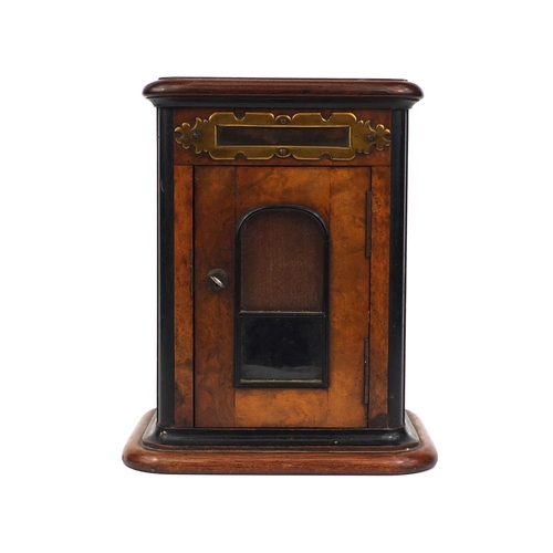 29 - Burr walnut and ebonised letterbox, with brass flap above a glazed door, 31cm high x 23cm wide x 17.... 