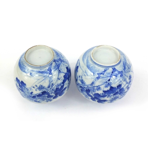 503 - Pair of Japanese blue and white porcelain vases, hand painted with flowers and foliage, each 10cm hi... 