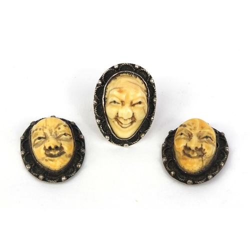 535 - Three Japanese carved ivory devil faces, one mounted as a ring, each 3.2cm high