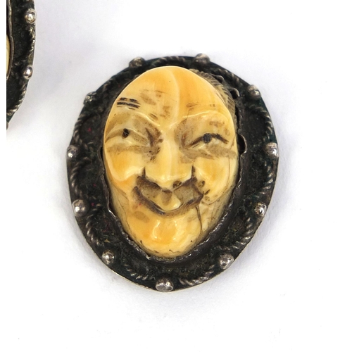 535 - Three Japanese carved ivory devil faces, one mounted as a ring, each 3.2cm high