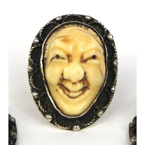 535 - Three Japanese carved ivory devil faces, one mounted as a ring, each 3.2cm high