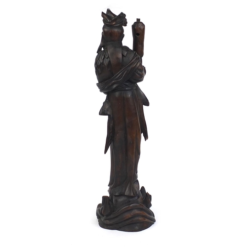 542 - Chinese root lamp base carved as a robed female standing upon a dragon, 52cm high