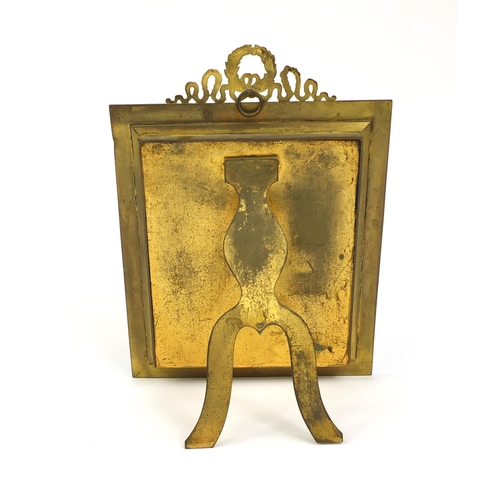 20 - Rectangular gilt brass easel photo frame with floral and wreath decoration, impressed AF to the ease... 