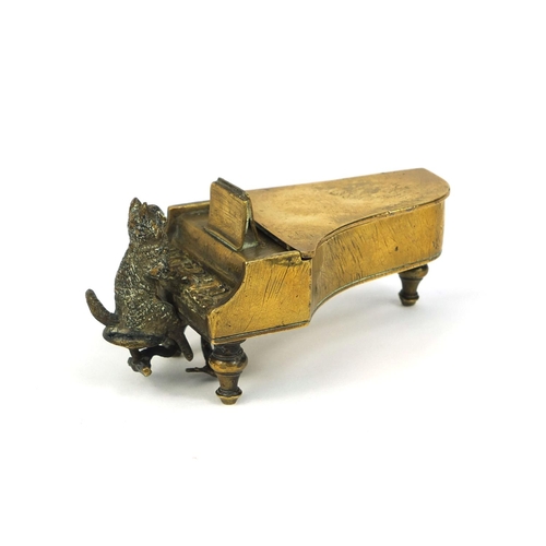 106 - 19th century cold painted bronze match striker, in the form of a cat playing a grand piano, the hing... 