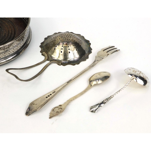 871 - Silver items comprising circular wine coaster, two sifting spoons, pair of napkin rings, teaspoon an... 