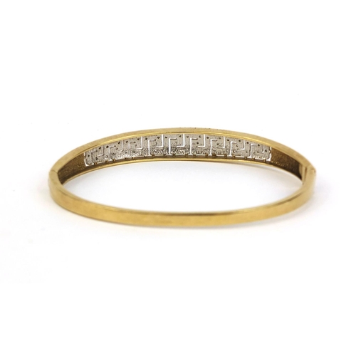 2442 - Unmarked gold diamond Greek key bangle, 7cm long, approximate weight 12.3g