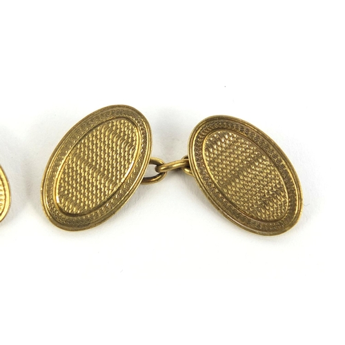 2443 - Pair of 9ct gold cufflinks with engine turned decoration, approximate weight 7.8g