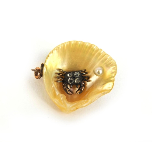 1010 - Unmarked gold oyster shell brooch, mounted with a crab set with diamonds and a seed pearl, 2.3cm lon... 