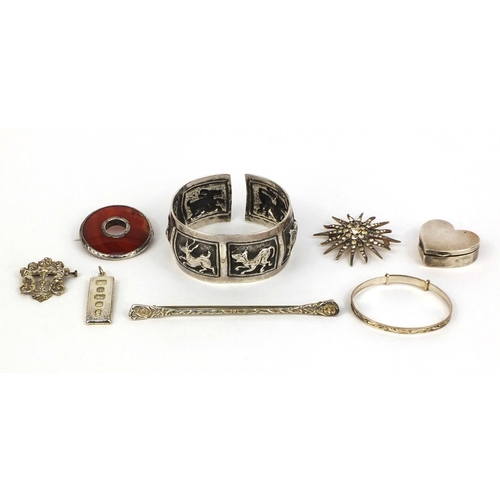 1021 - Assorted silver jewellery comprising Middle Eastern unmarked bangle embossed with wild animals, cher... 