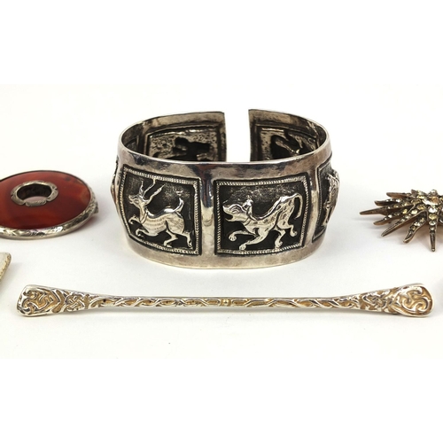 1021 - Assorted silver jewellery comprising Middle Eastern unmarked bangle embossed with wild animals, cher... 