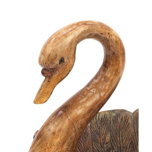 2116 - Floor standing carved and painted wooden swan, 57cm high