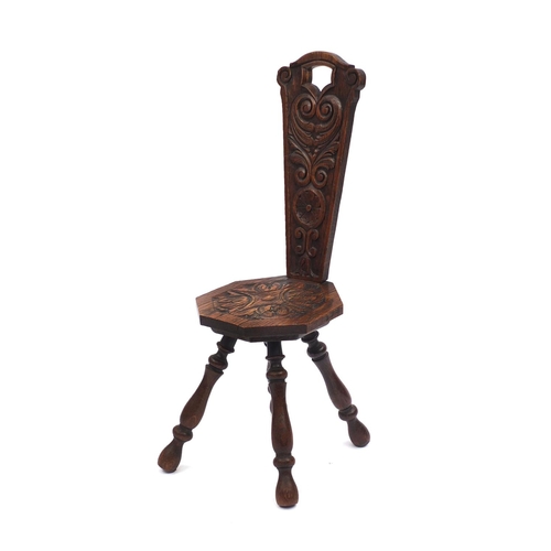 2051 - Carved oak four legged spinning chair with octagonal seat 85cm high