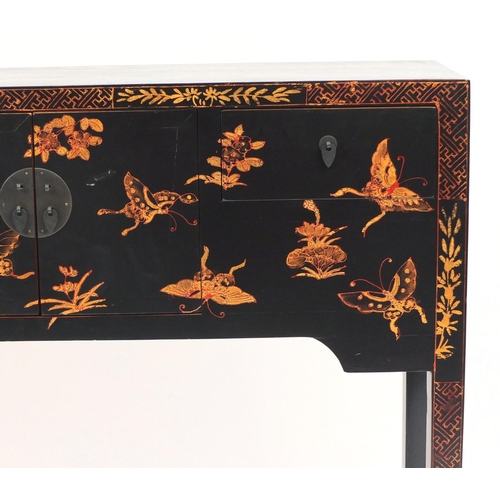 2025 - Oriental black painted wooden hall table decorated with gilt butterflies and flowers, fitted with a ... 