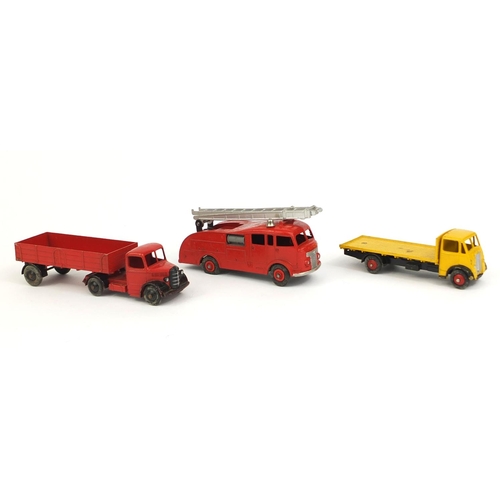 409 - Three die cast Dinky Toys with boxes, comprising fire engine with extending ladder 555, Guy flat tru... 