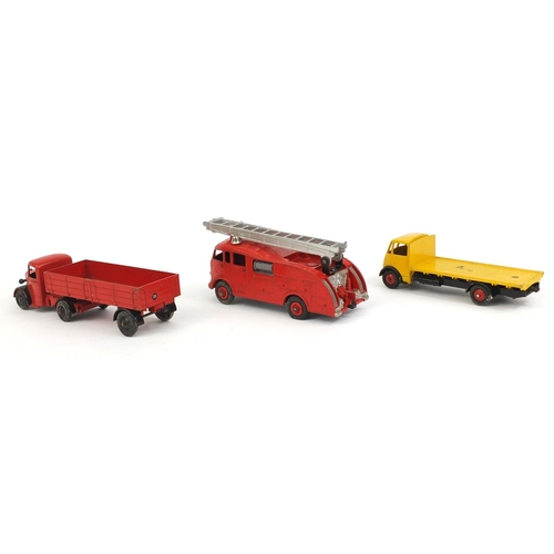 409 - Three die cast Dinky Toys with boxes, comprising fire engine with extending ladder 555, Guy flat tru... 