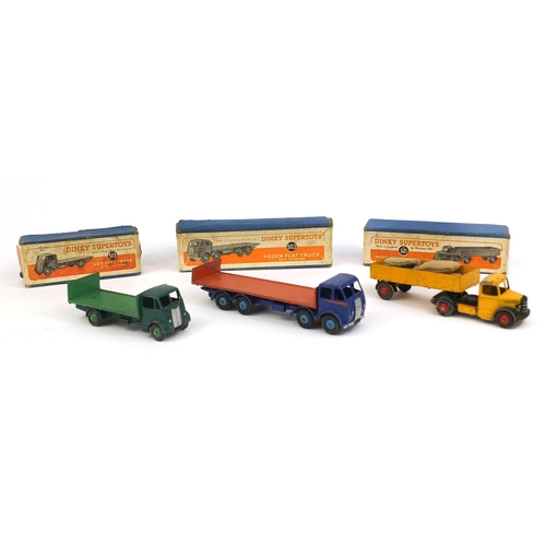 410 - Three Dinky Super Toys with boxes, comprising Guy flat truck 513, Bedford articulated lorry 521 and ... 