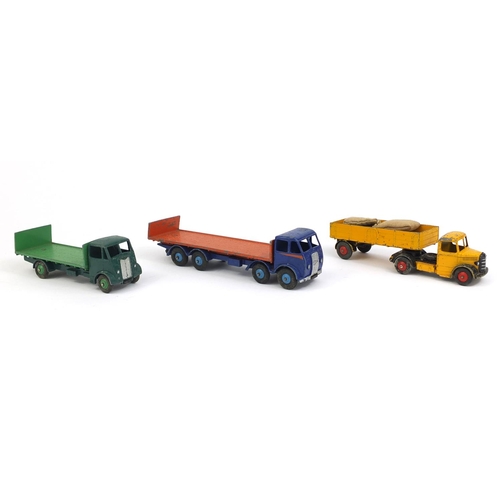 410 - Three Dinky Super Toys with boxes, comprising Guy flat truck 513, Bedford articulated lorry 521 and ... 