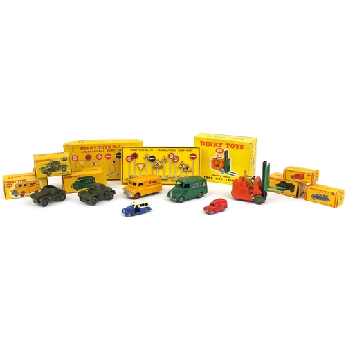 412 - Seven Dinky Toys die cast vehicles and International road signs 771 with boxes, the vehicles compris... 