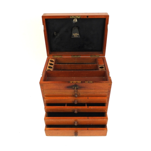 59 - The Dental Manufacturing Co of London mahogany dental case, with lift up top above six pull out draw... 
