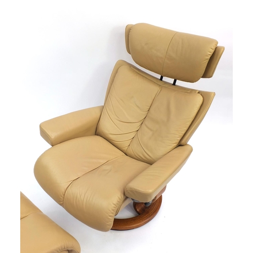 2001 - Stressless beige leather chair with foot stool, the chair 106cm high