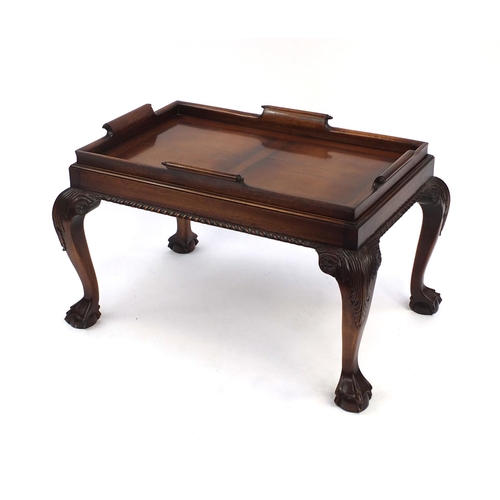 2006 - Carved mahogany butlers tray on stand table with ball and claw feet, 53cm high x 80cm wide x 58cm de... 