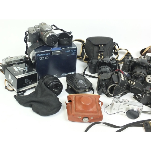 215 - Box of assorted cameras, lenses  and accessories including Pentax, Canon, Panasonic and Ziag example... 